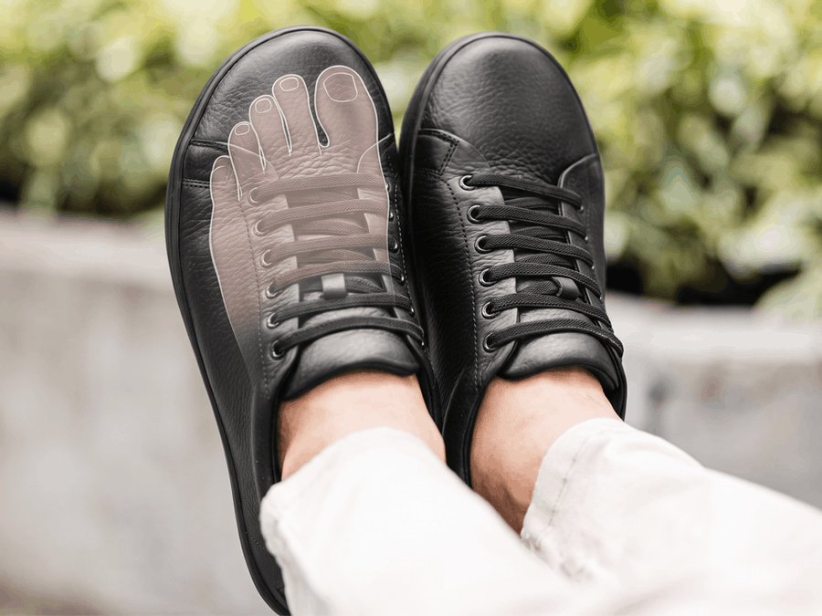 Wide toe box with a foot outline showing room to spread